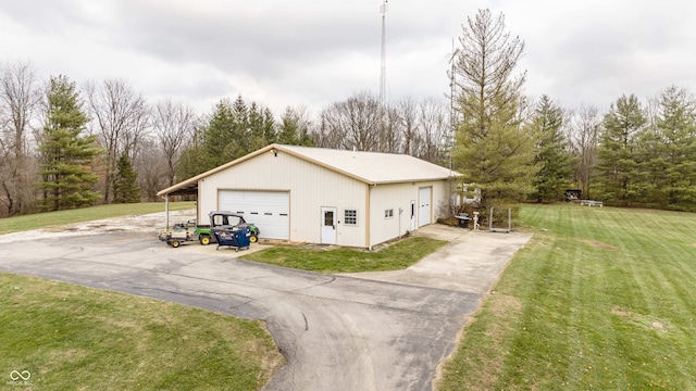 1510 S Greensboro Pike, New Castle, IN 47362 - view of home's exterior with a garage, an outdoor structure, and a lawn