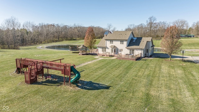 1510 S Greensboro Pike, New Castle, IN 47362 - rear view of property featuring a playground, a lawn, and a deck