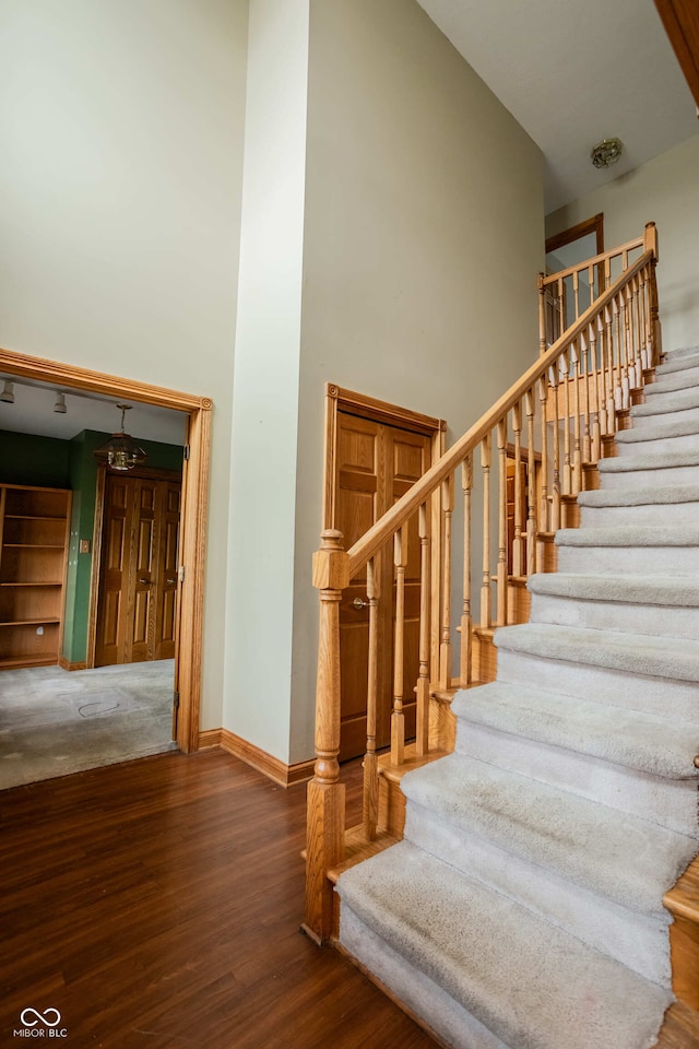 1510 S Greensboro Pike, New Castle, IN 47362 - stairs featuring a high ceiling and hardwood / wood-style flooring