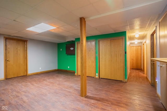 1510 S Greensboro Pike, New Castle, IN 47362 - basement featuring a paneled ceiling and light wood-type flooring