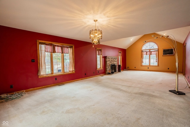 1510 S Greensboro Pike, New Castle, IN 47362 - unfurnished living room with a brick fireplace, vaulted ceiling, a wall mounted AC, a chandelier, and carpet floors
