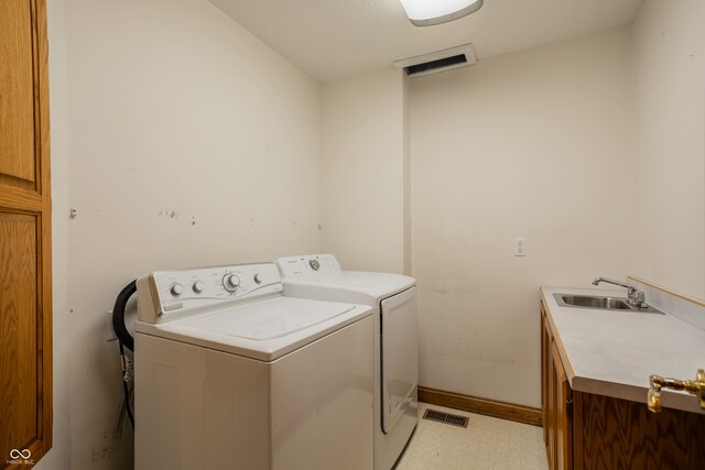1510 S Greensboro Pike, New Castle, IN 47362 - laundry room with washer and clothes dryer, cabinets, and sink