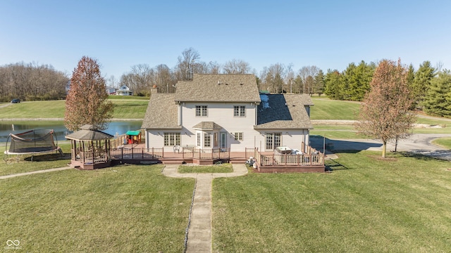 1510 S Greensboro Pike, New Castle, IN 47362 - back of property featuring a gazebo, a lawn, a deck with water view, and a trampoline
