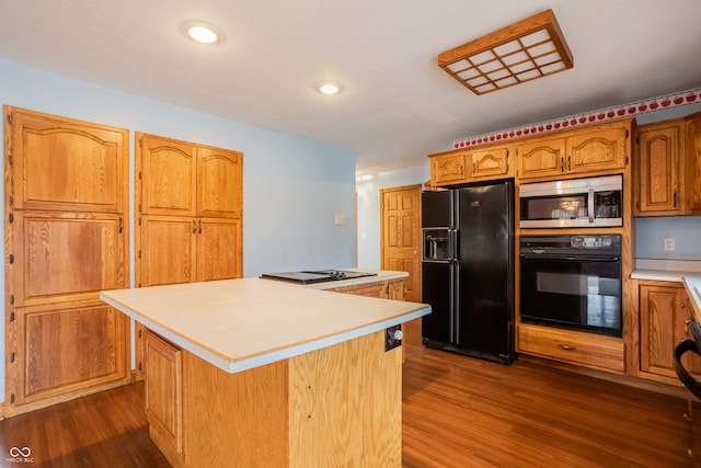 1510 S Greensboro Pike, New Castle, IN 47362 - kitchen with a center island, dark hardwood / wood-style floors, and black appliances