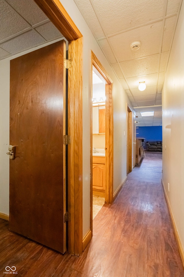 1510 S Greensboro Pike, New Castle, IN 47362 - corridor featuring a drop ceiling and hardwood / wood-style flooring