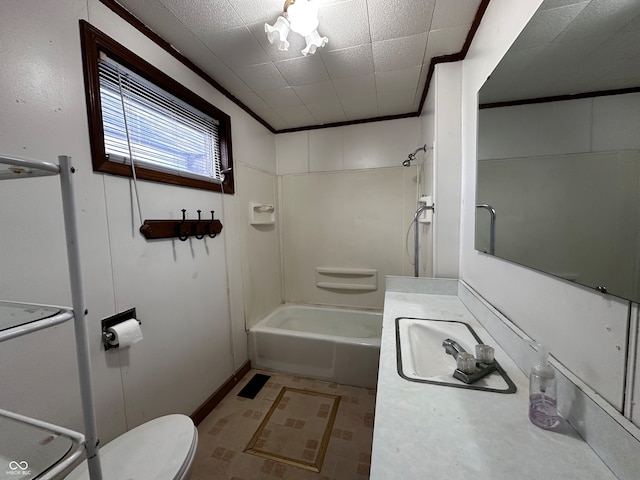 full bathroom with washtub / shower combination, toilet, vanity, and crown molding