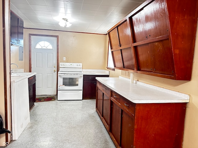 kitchen with sink and white range with electric cooktop