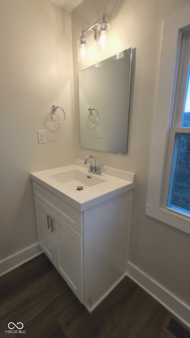 bathroom featuring hardwood / wood-style floors and vanity