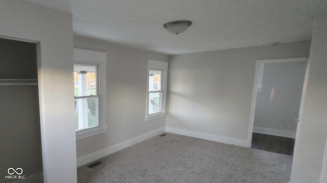 unfurnished bedroom with carpet