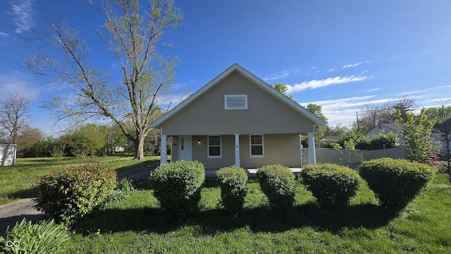 exterior space featuring a porch and a front lawn