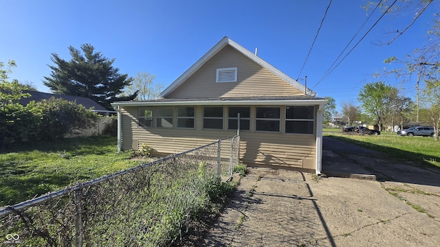 rear view of house with fence
