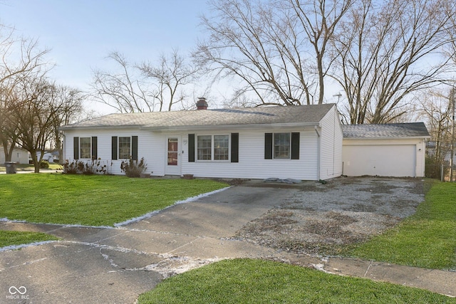 ranch-style house featuring a front yard and a garage