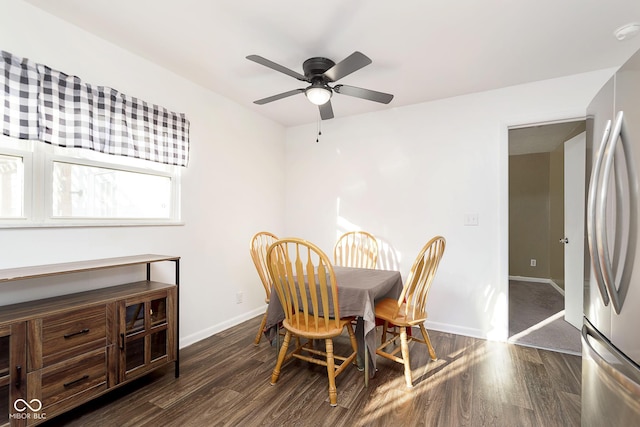 dining area with ceiling fan and dark hardwood / wood-style flooring