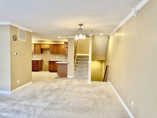 interior space with light carpet, an inviting chandelier, crown molding, a textured ceiling, and decorative light fixtures