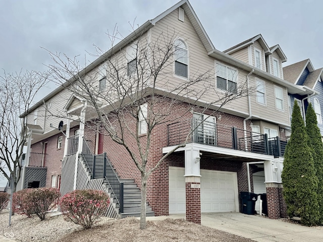 view of front facade with a balcony and a garage