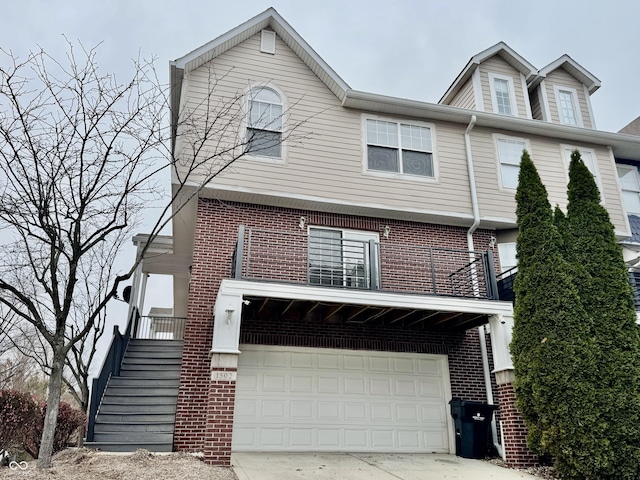 view of front facade with a balcony and a garage