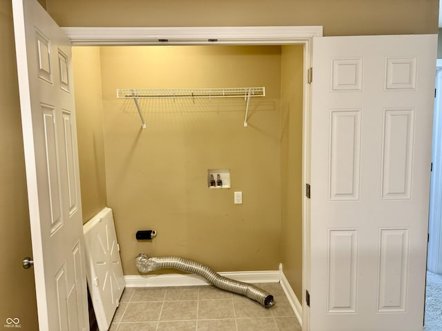 washroom featuring hookup for a washing machine and light tile patterned flooring