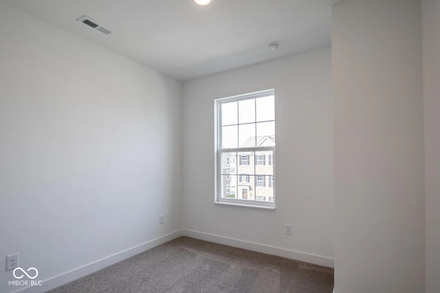 unfurnished room featuring carpet flooring