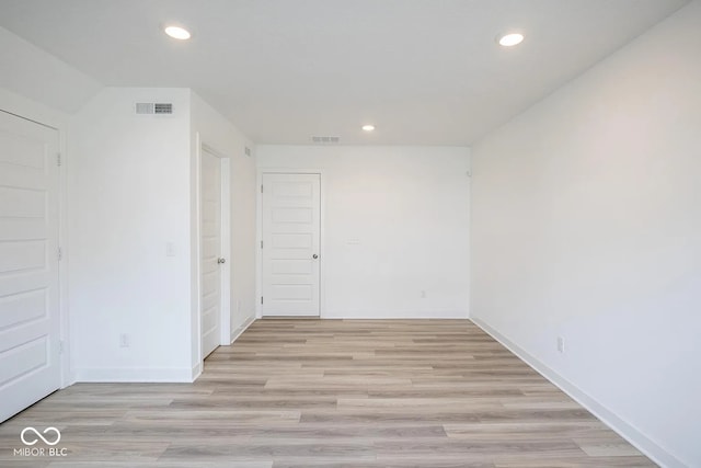 unfurnished room with light hardwood / wood-style flooring