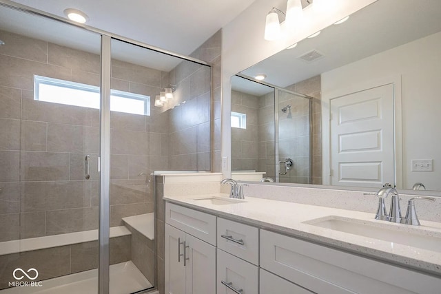 bathroom featuring vanity and walk in shower