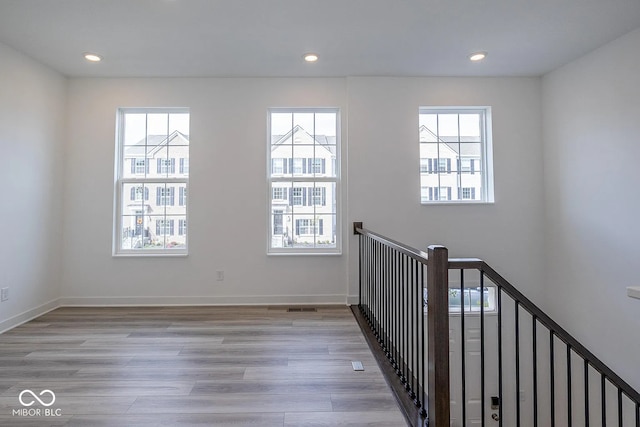 interior space with a healthy amount of sunlight and light hardwood / wood-style floors