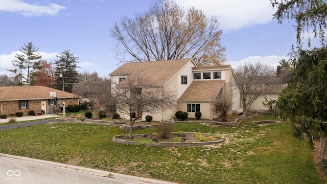 view of front of home featuring a front yard