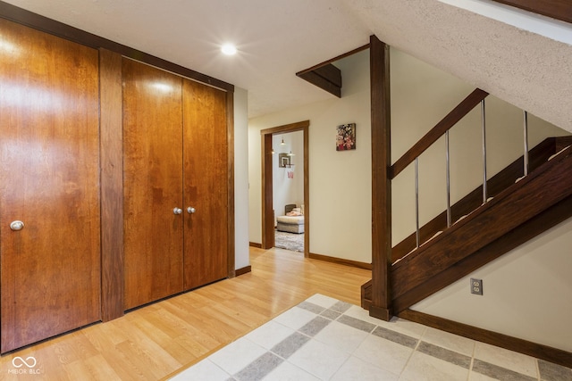 foyer entrance with light hardwood / wood-style floors