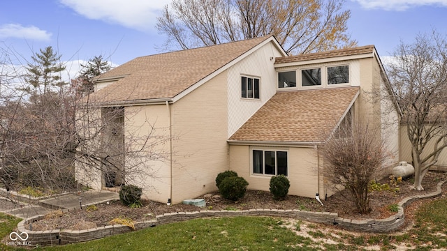 view of side of property with a yard