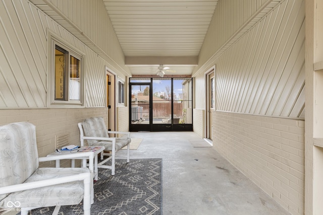 sunroom featuring ceiling fan