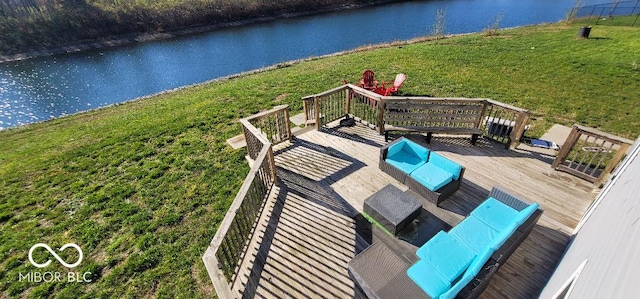 deck featuring a lawn, a water view, and an outdoor hangout area