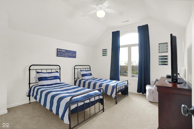 bedroom with ceiling fan, light carpet, and vaulted ceiling