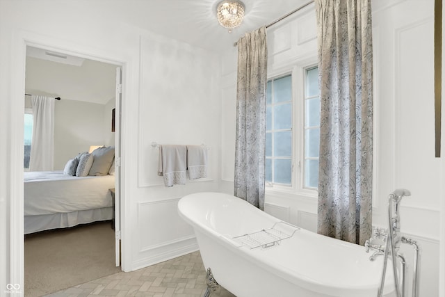 bathroom featuring a tub to relax in