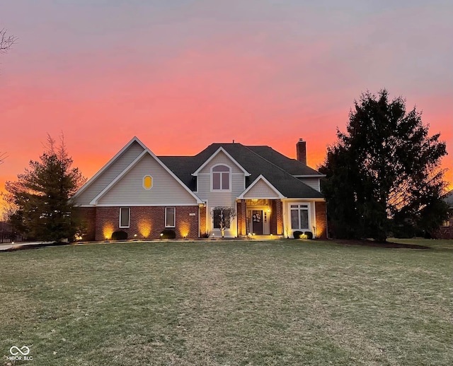 view of front of home with a yard