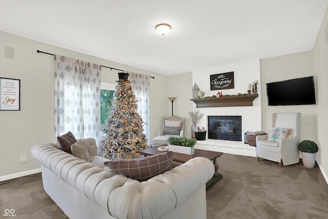 carpeted living room with a fireplace