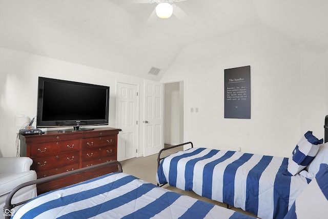 bedroom with ceiling fan, light carpet, and vaulted ceiling