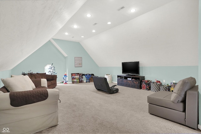 carpeted living room featuring vaulted ceiling