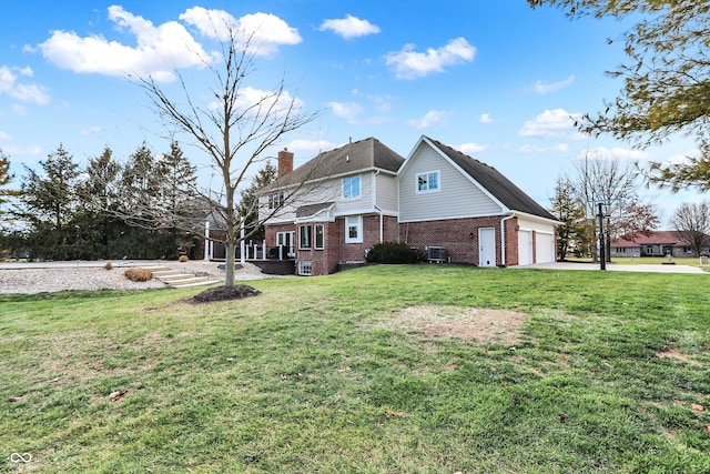 view of home's exterior featuring a lawn, a garage, and central air condition unit