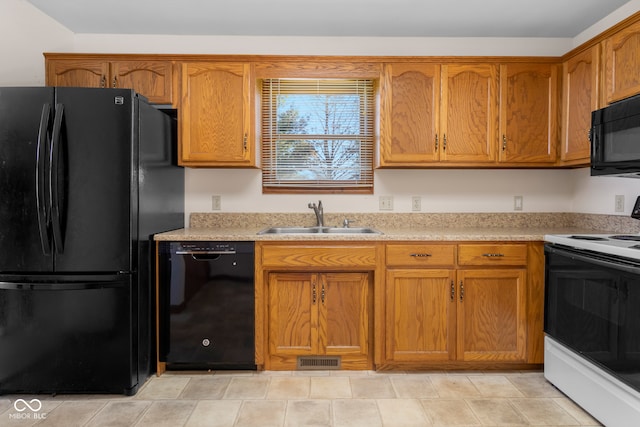 kitchen with sink and black appliances