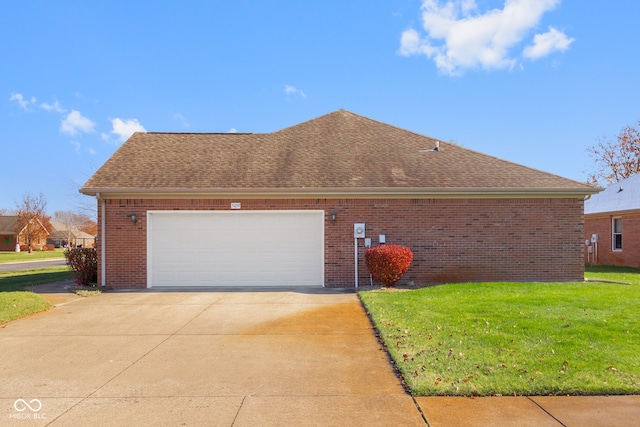 view of property exterior featuring a garage and a lawn