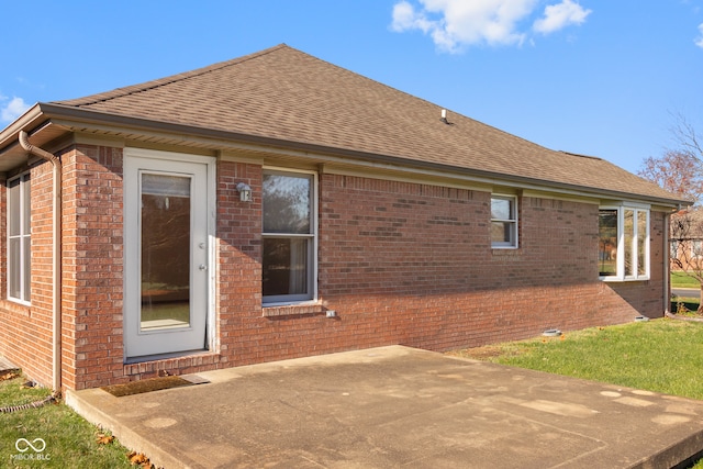 back of house with a patio