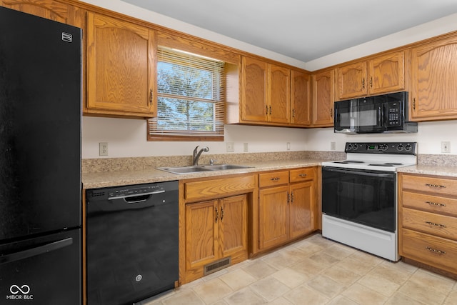 kitchen featuring sink and black appliances