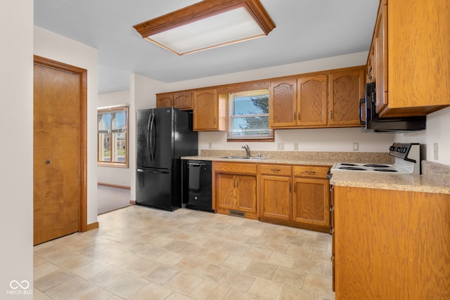 kitchen featuring sink and black appliances