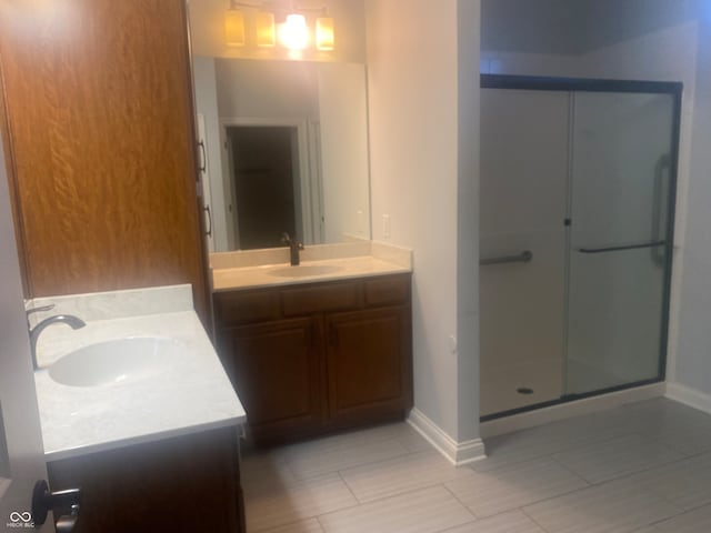 bathroom with vanity and an enclosed shower