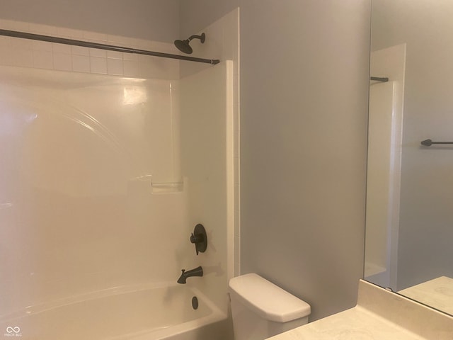 full bathroom featuring vanity,  shower combination, and toilet