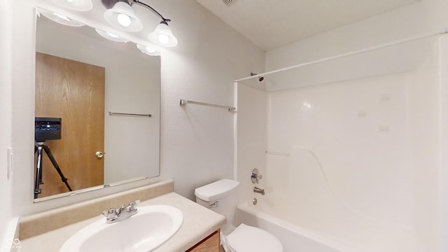 full bathroom featuring shower / bathing tub combination, vanity, and toilet