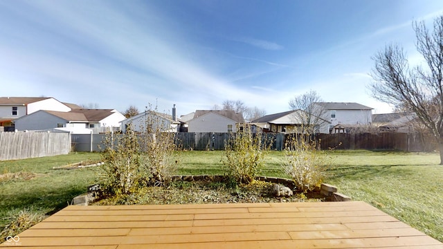 wooden terrace featuring a yard