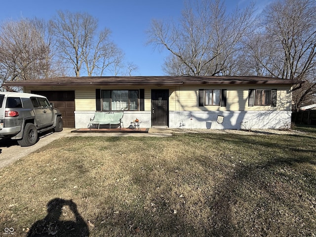 single story home with a front lawn and a garage