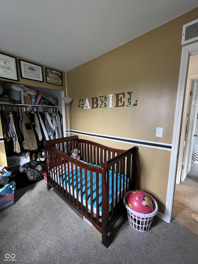 carpeted bedroom with a nursery area