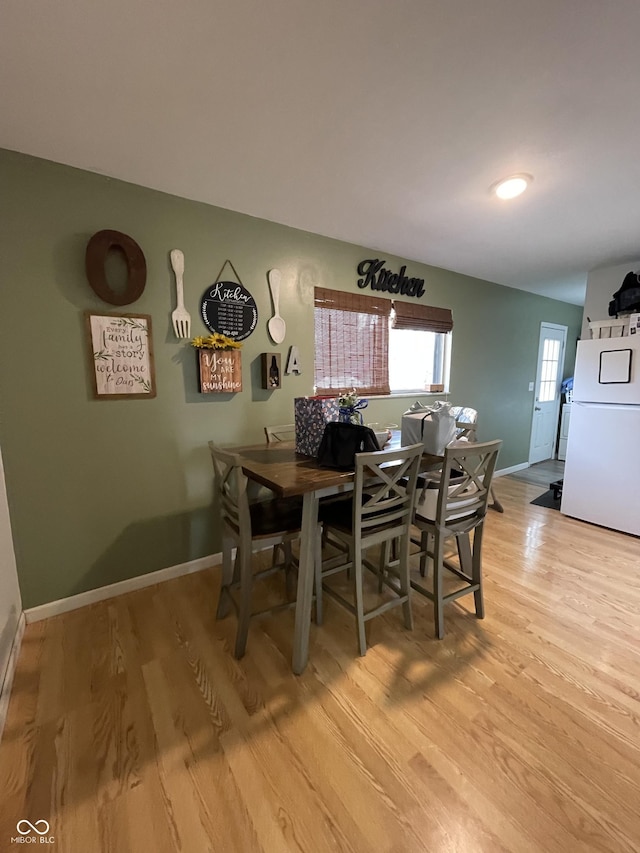 dining space featuring light hardwood / wood-style flooring