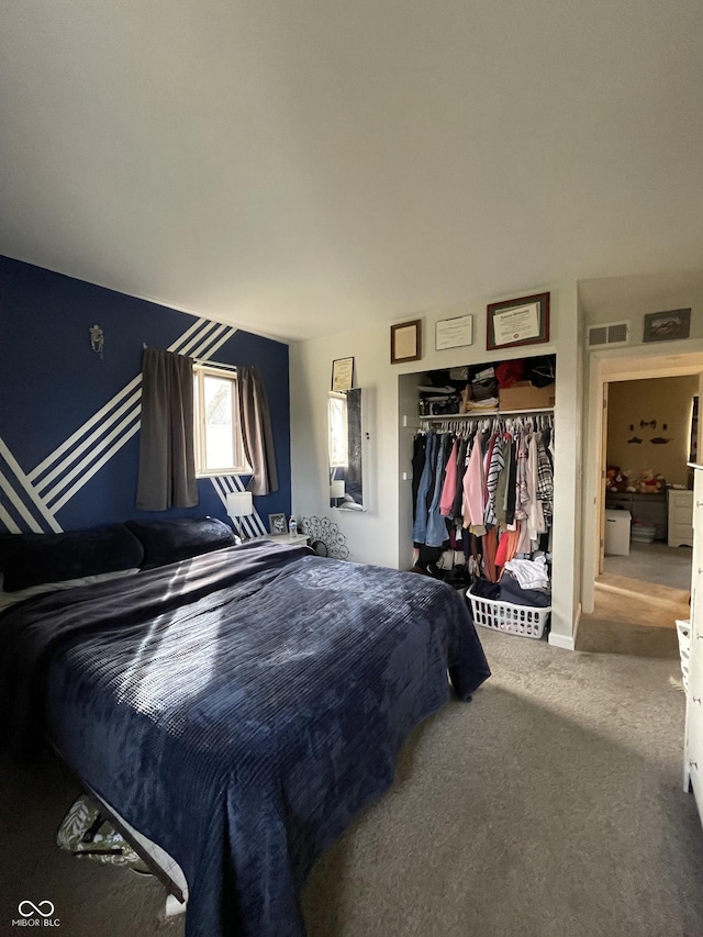 bedroom with carpet and a closet